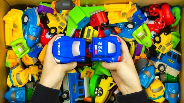Box full of various toy cars